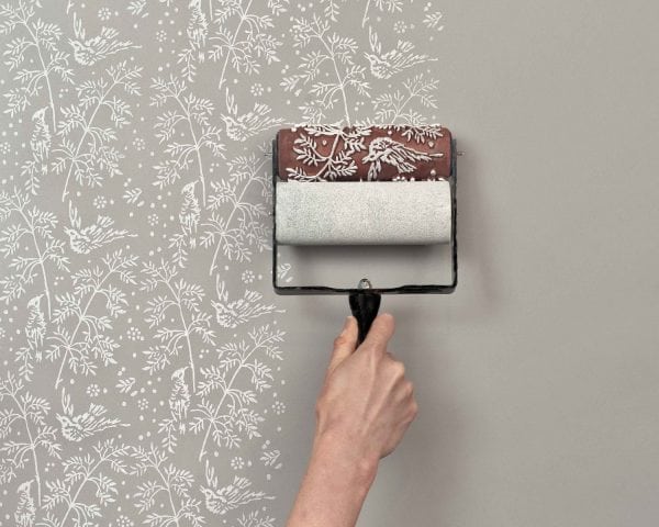 Wall decoration with a screen roller