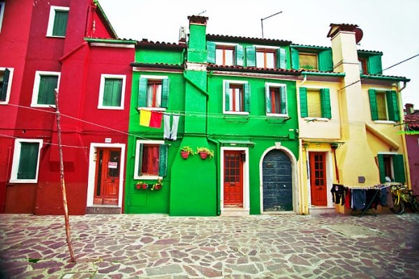 The houses are painted in different colors.