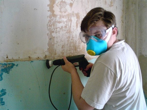 Removing paint from walls with power tools