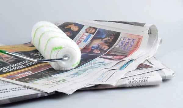 Cleaning the newspaper roller