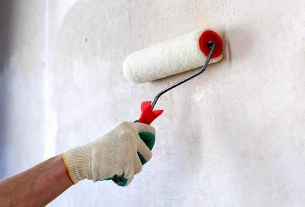 Priming the wall with a roller