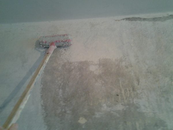 Priming concrete wall