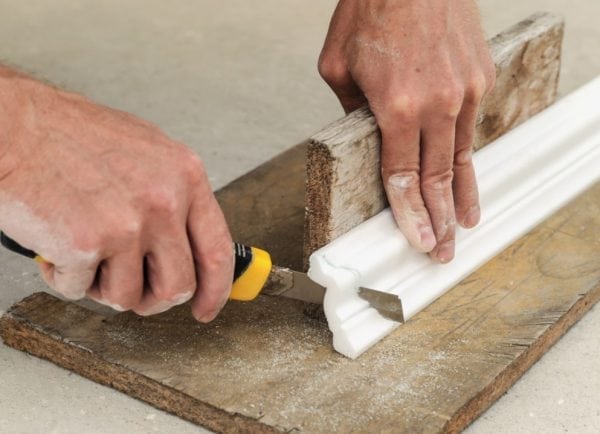 A method of cutting a ceiling skirting board without a miter box