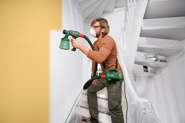 You can use a spray gun to paint paper wallpapers.