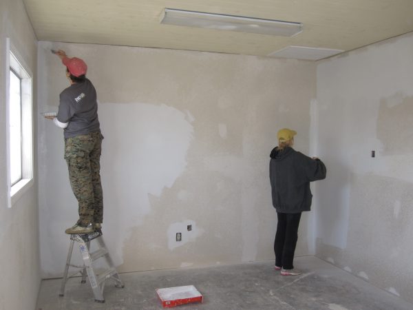 Preparing a wall for laying tiles