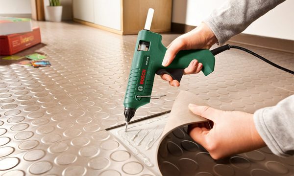 Bonding linoleum with hot melt adhesive