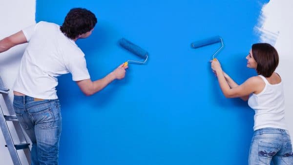 Painting walls with a water-based emulsion