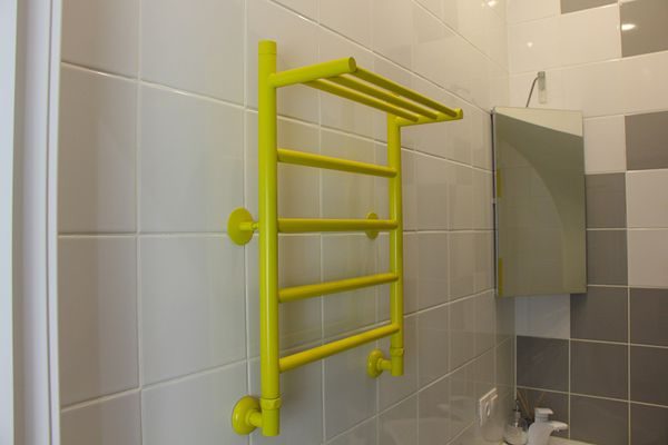 Heated towel rail in the bathroom