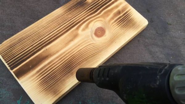 Fire brushing wood