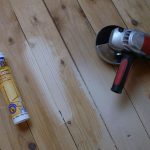 Means for sealing joints in a wooden floor