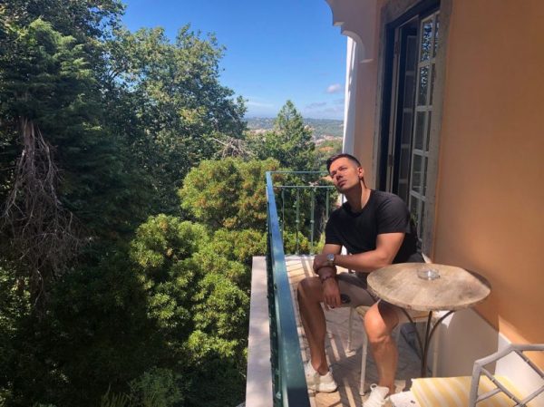 Stas Pieha on the balcony of his apartment in Moscow