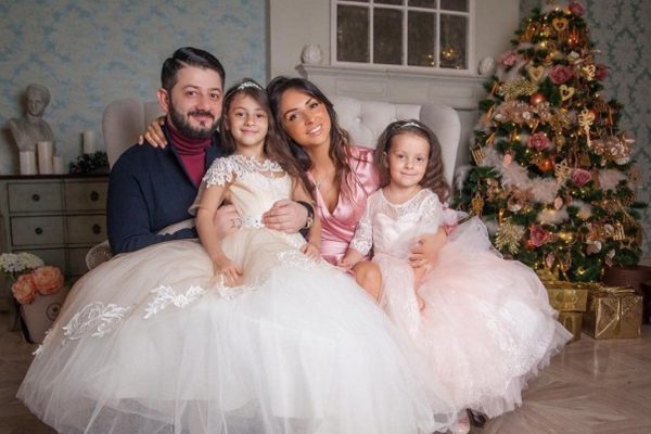 With his wife and children in his apartment