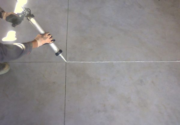 Sealing joints in concrete floor