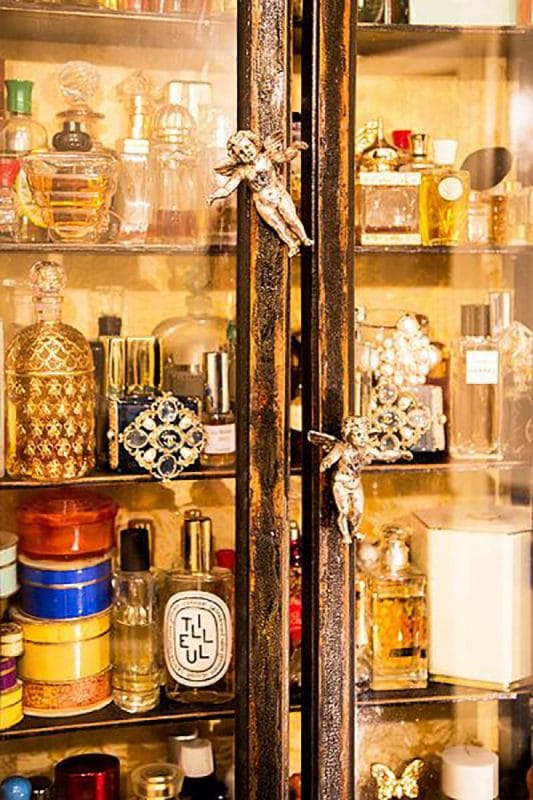 Perfumery closet in Litvinova’s apartment with handles of angels