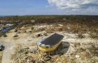 A round stilt house that stands after a hurricane