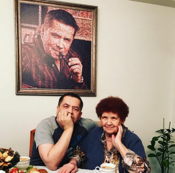 In the dining room against the background of his portrait