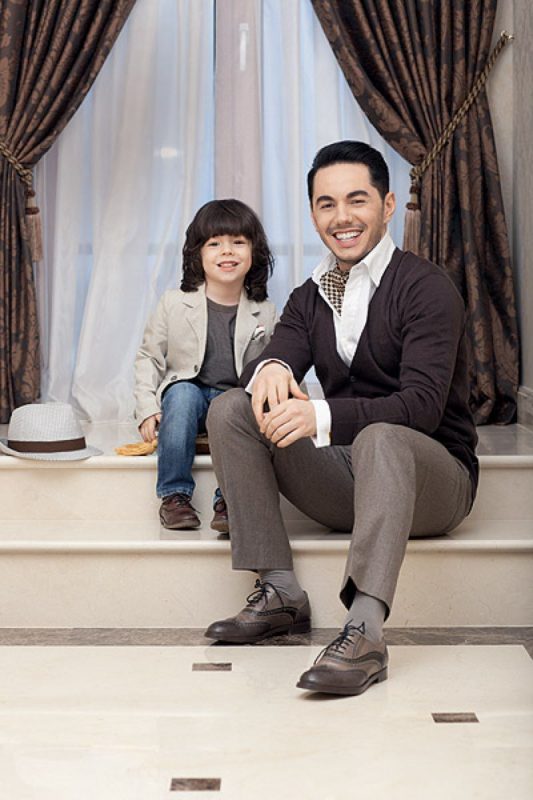 Timur Rodriguez with a small son