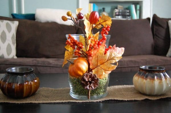 Decorating a vase with autumn leaves