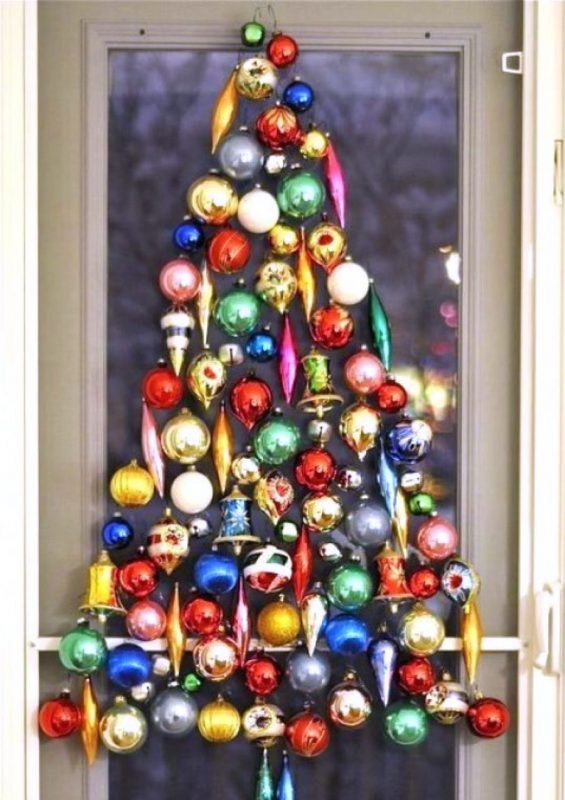 Christmas tree made from Christmas toys on the wall