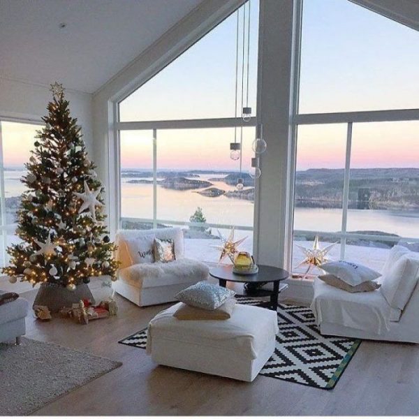 Interior with Christmas tree by the window in winter