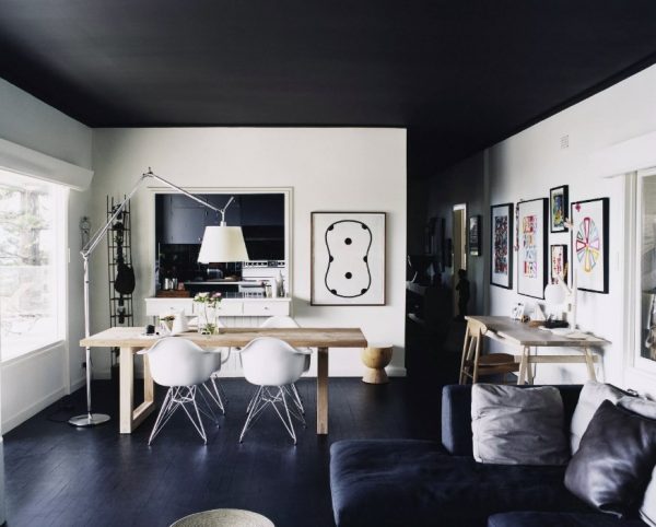 Interior of a room with a black ceilingBlack ceiling white floorBlack ceiling gray wallsBlack suspended ceiling in the interior photo