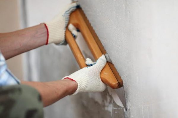 Preparing walls for plastering a world map